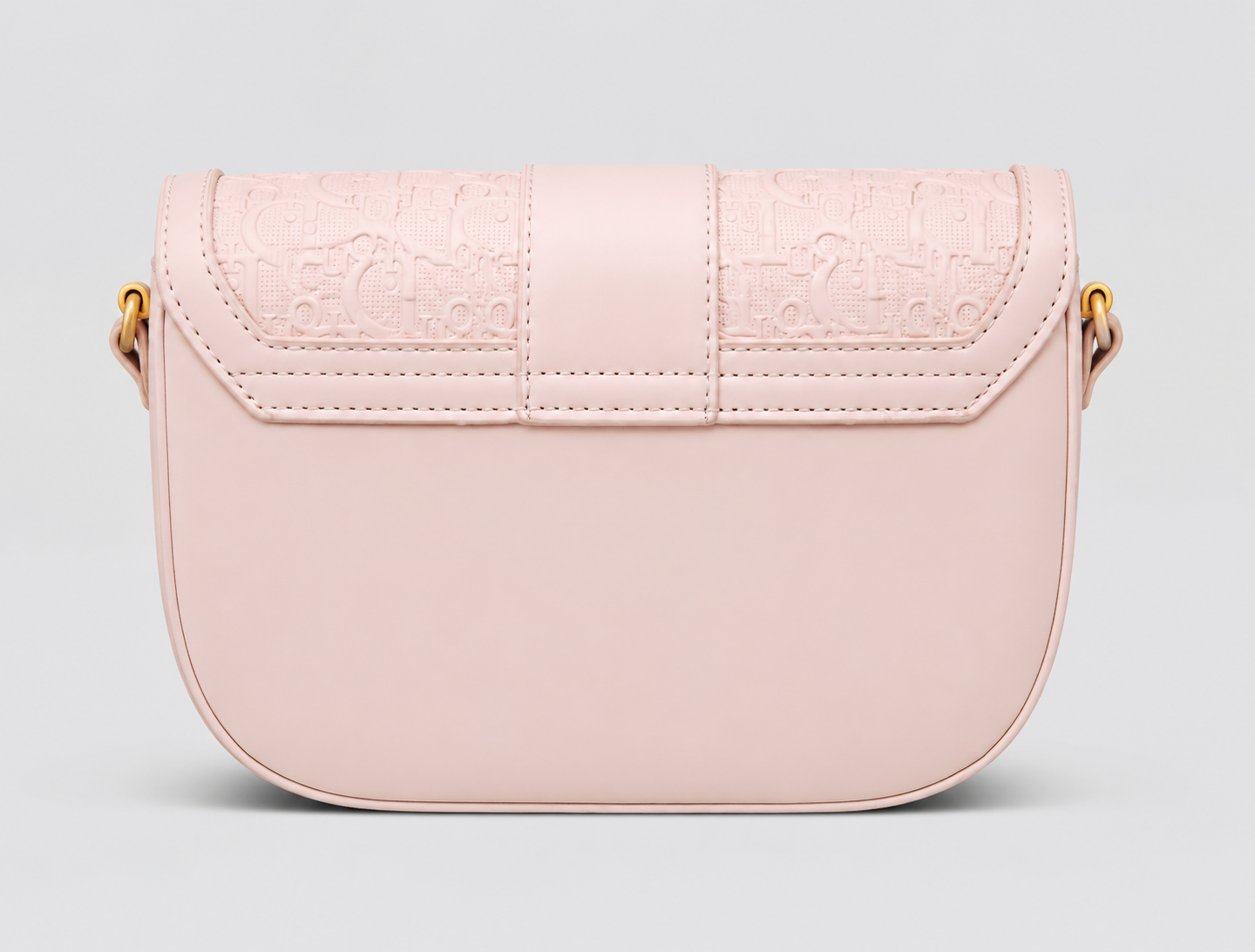 Monogram Embossed Leather Saddle Bag — Blush Pink with Gold CD Clasp & Shoulder Strap